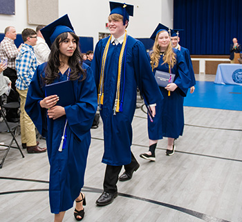graduates walking down the aisle
